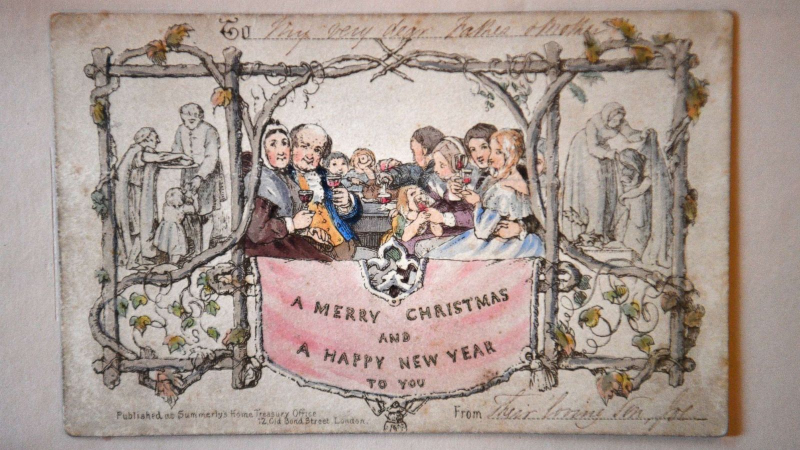 PHOTO: The world's first printed Christmas card is displayed at the Dickens House Museum in London, Nov. 19, 2019. The hand colored lithograph card was produced in 1843 and sold for one shilling.