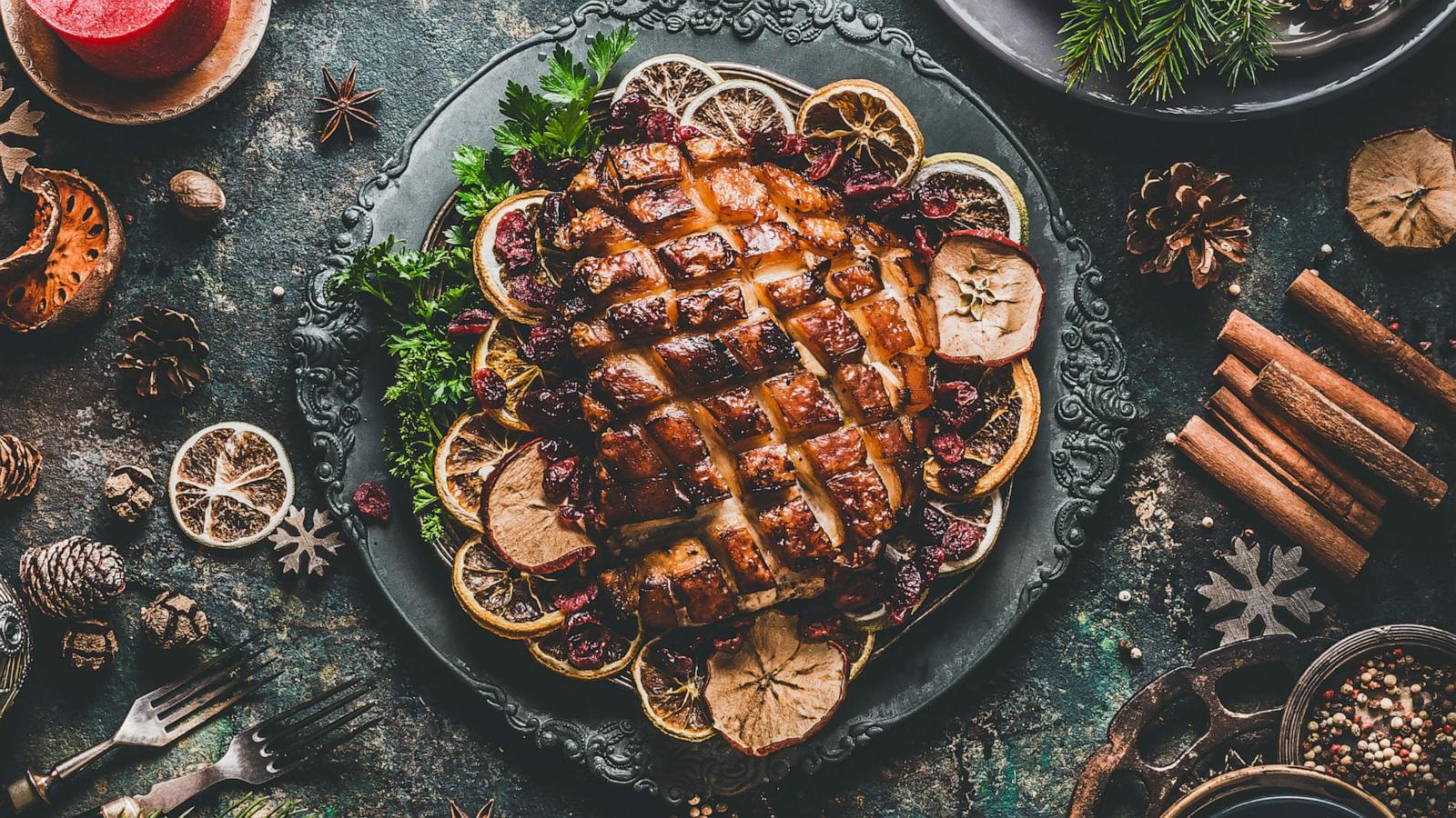 PHOTO: In this undated stock photo, a dinner table with roasted ham and Christmas decorations is seen from above.