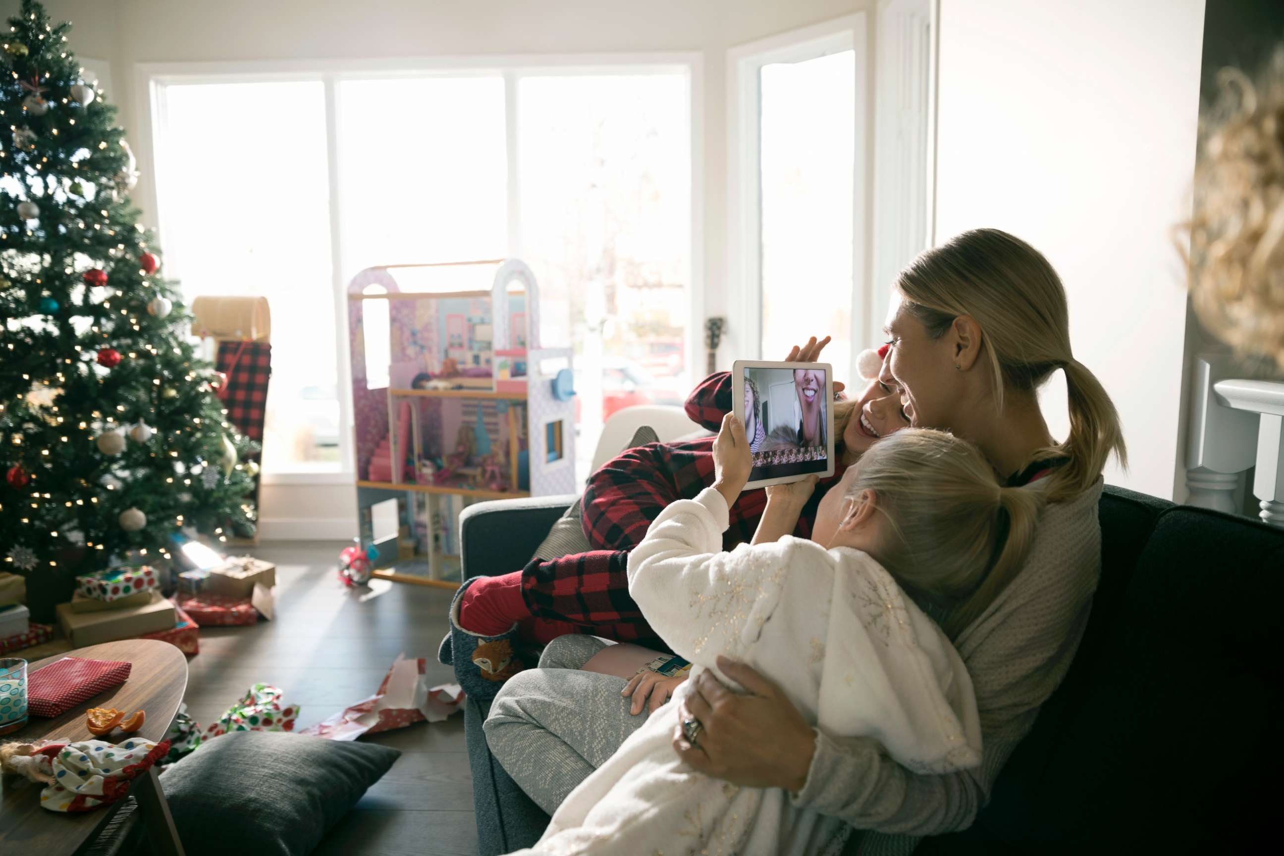 PHOTO: This stock photo depicts a mom with her children on Christmas morning.