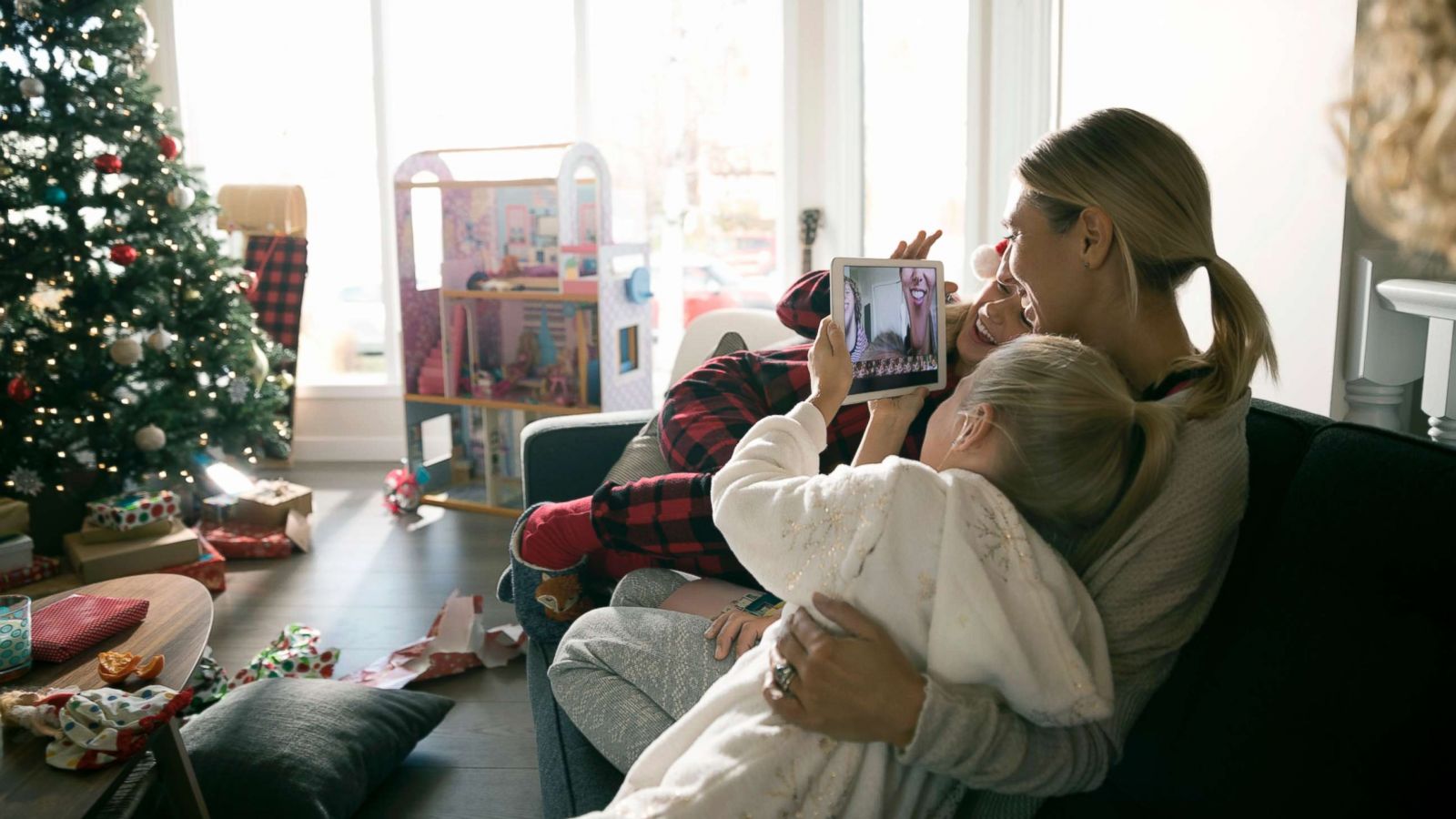 PHOTO: This stock photo depicts a mom with her children on Christmas morning.