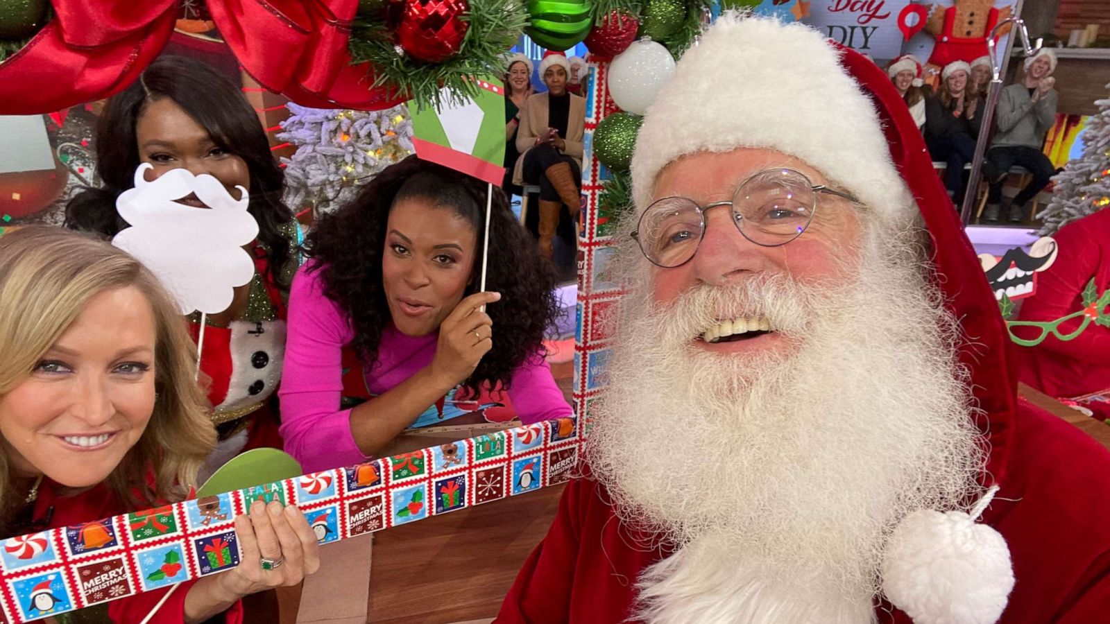 PHOTO: "GMA's" Lara Spencer, Daneshia Lynch of DrunkN Shots and craft expert Amber-Kemp Gerstel pose for an "Elfie" with Santa Claus during "Good Morning America's" Christmas Day 2019 episode.