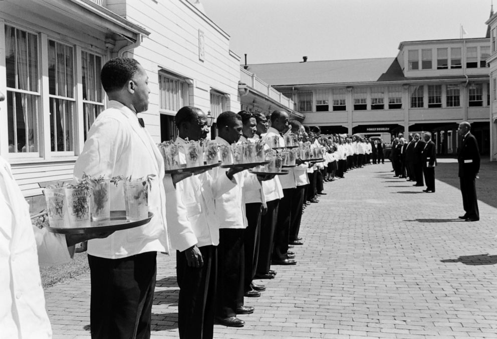 PHOTO: Kentucky Derby:Julep-laden waiters line up for pre-Derby inspection outside Churchill Downs clubhouse before serving early arrivals.