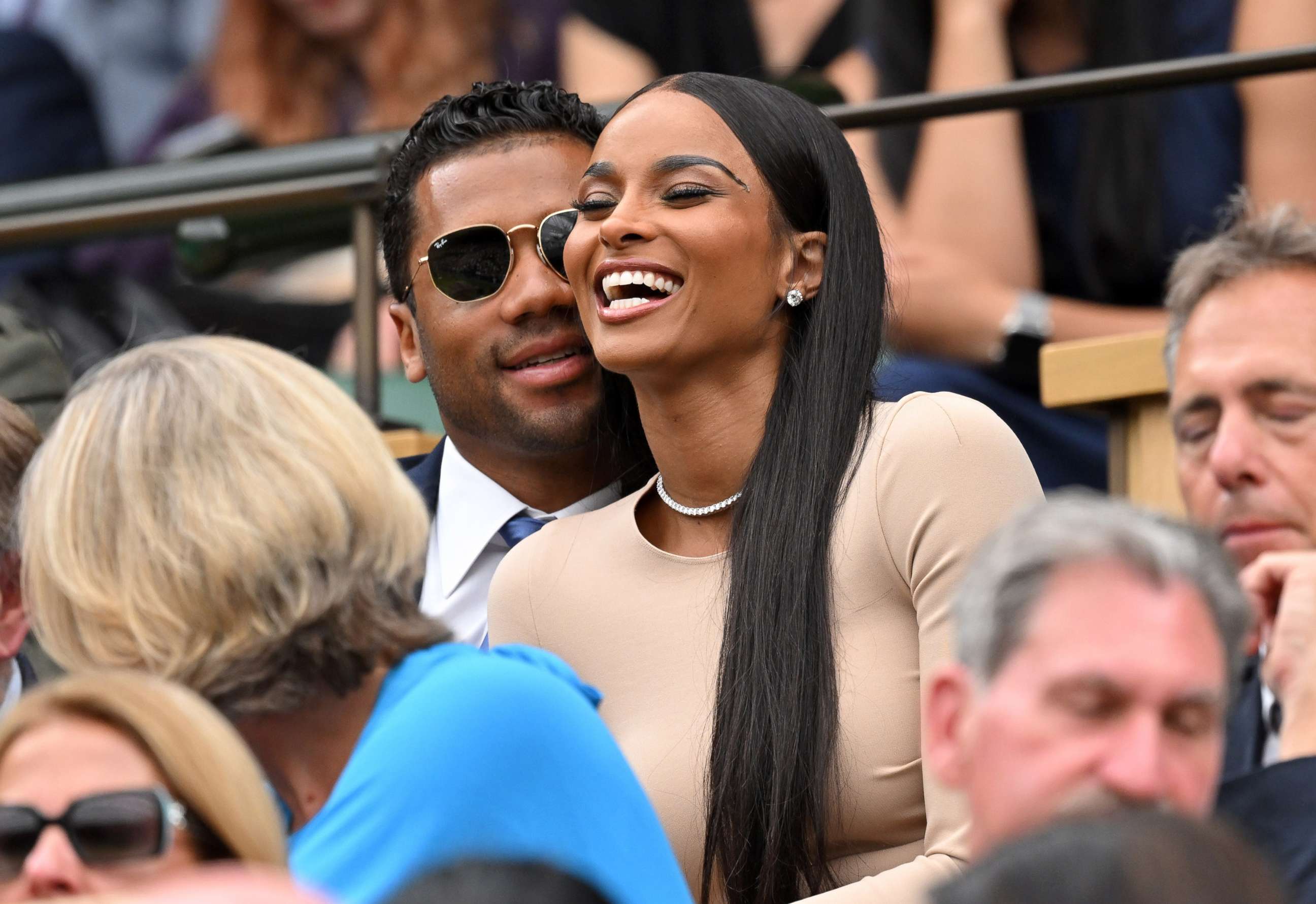 PHOTO: Russell Wilson and Ciara laugh as they attend Day Four of Wimbledon 2022 at the All England Lawn Tennis and Croquet Club, June 30, 2022, in London.