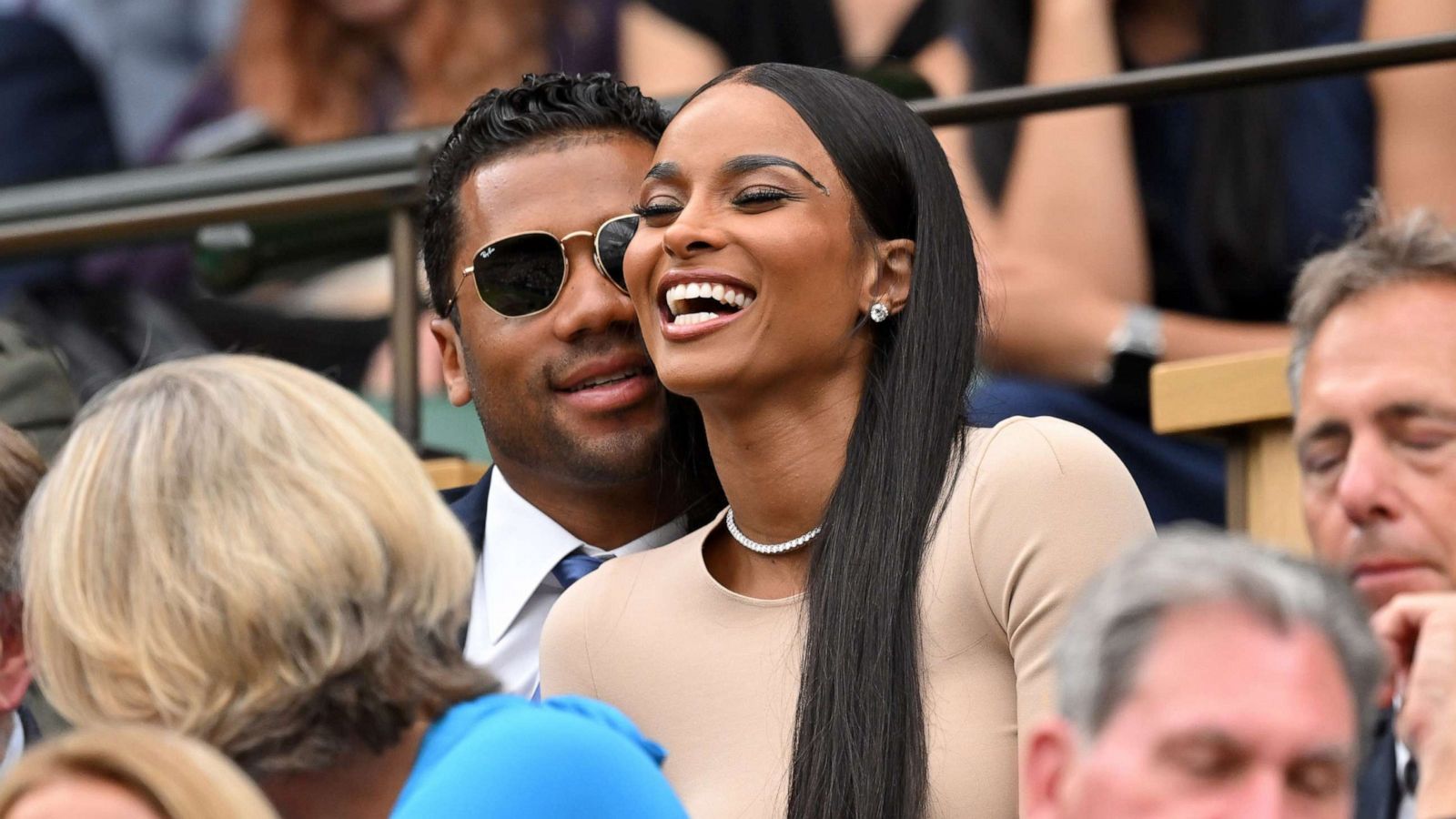 PHOTO: Russell Wilson and Ciara laugh as they attend Day Four of Wimbledon 2022 at the All England Lawn Tennis and Croquet Club, June 30, 2022, in London.