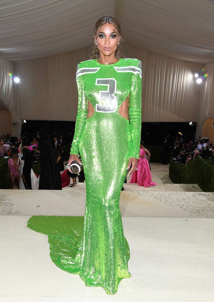 Ciara wears a lime green dress in her husband Russell Wilson's Seattle Seahawks' colors with his number three on the front at The 2021 Met Gala Celebrating In America: A Lexicon Of Fashion at Metropolitan Museum of Art on Sept. 13, 2021, in New York City.