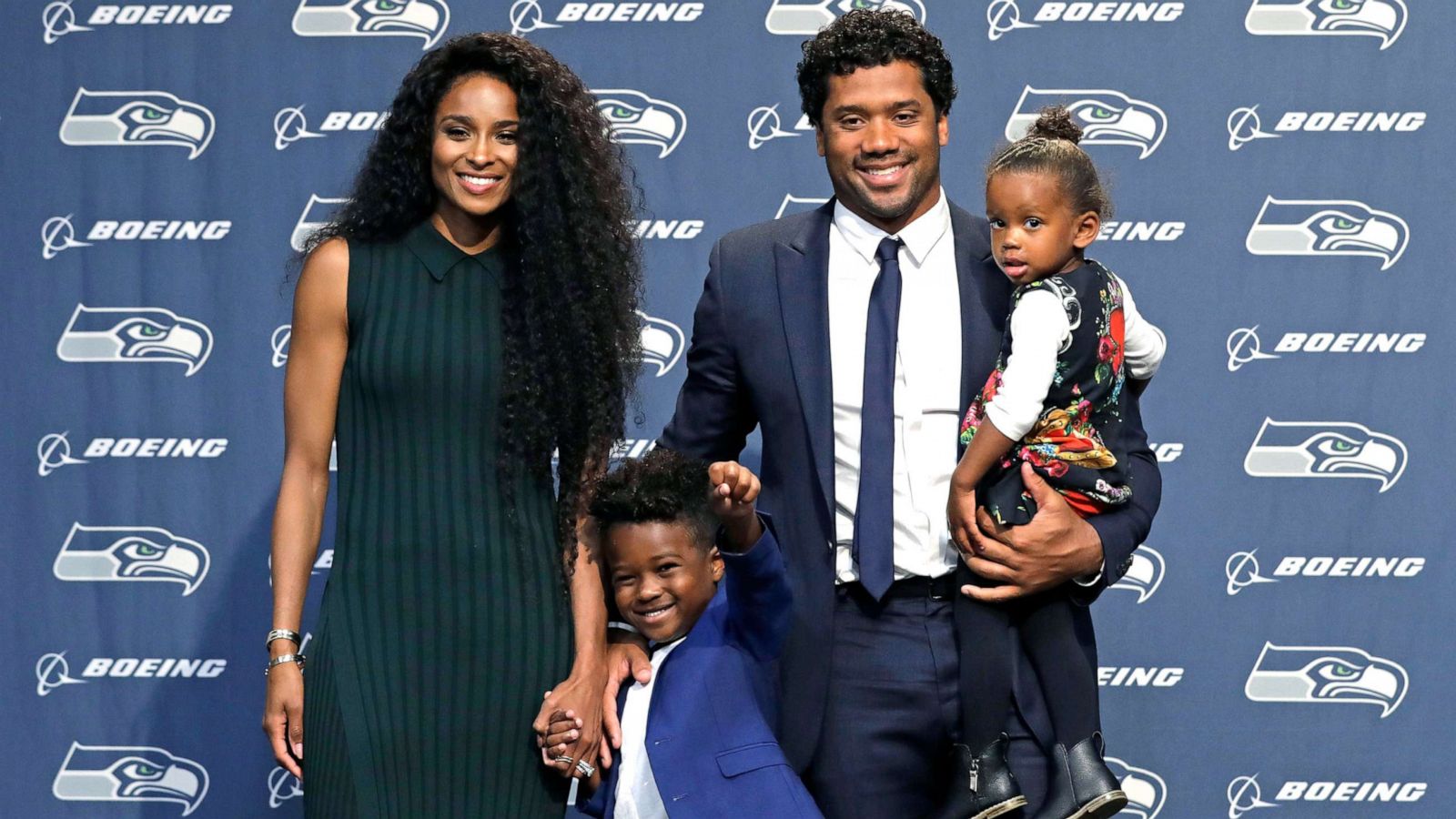 PHOTO: Seattle Seahawks quarterback Russell Wilson poses for photos with his wife Ciara, their daughter Sienna, and Ciara's son Future in Renton, Wash., Aug. 13, 2019.