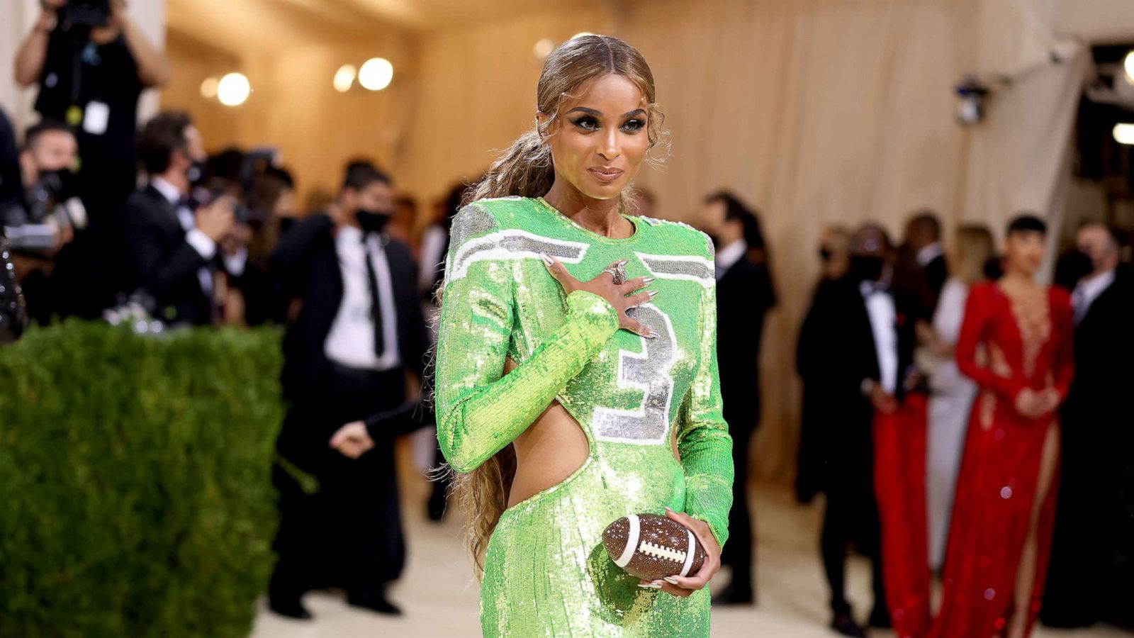 PHOTO: Ciara wears a lime green dress in her husband Russell Wilson's Seattle Seahawks' colors at The 2021 Met Gala Celebrating In America: A Lexicon Of Fashion at Metropolitan Museum of Art on Sept. 13, 2021, in New York City