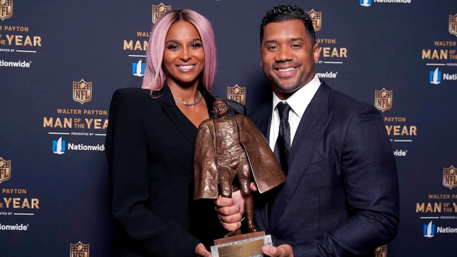 PHOTO: Seattle Seahawks quarterback Russell Wilson and his wife Ciara pose for a photo after Wilson won the Walter Payton NFL Man of the Year awards at the NFL Honors ceremony as part of Super Bowl 55, Feb. 5, 2021, in Tampa, Fla.