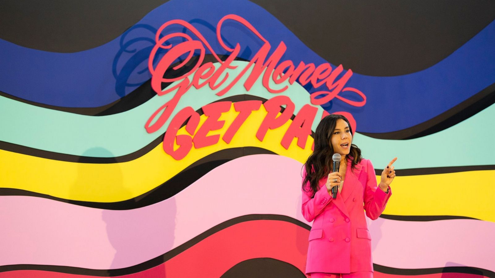 PHOTO: Claire Wasserman, founder of Ladies Get Paid, speaks to a group of women during an event.