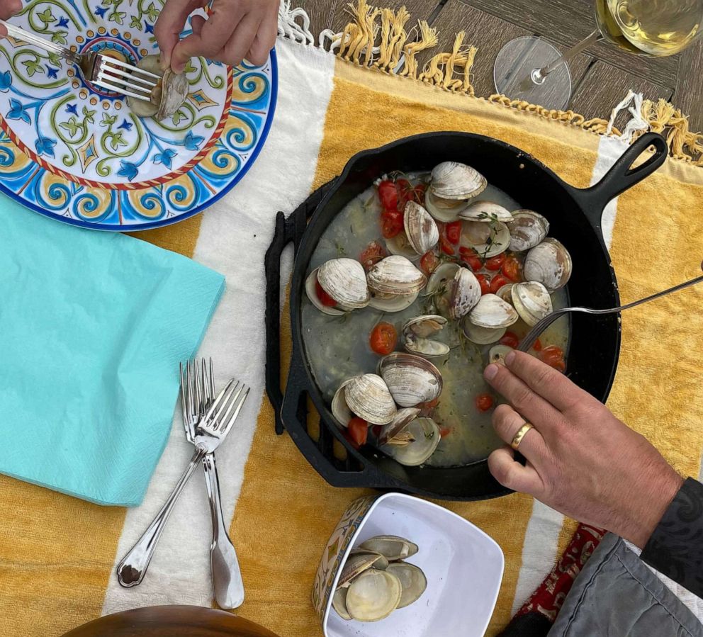 PHOTO: Littleneck clams steamed in a white wine broth with herbs.