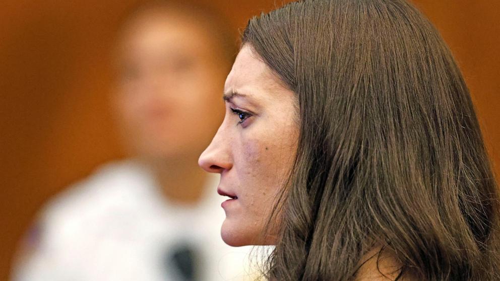 PHOTO: Lindsay Clancy, who is accused of killing her children, watches as her ex-husband Patrick Clancy takes the witness stand, during her murder trial at Plymouth Superior Court, in Plymouth, Mass, July 27, 2026. 