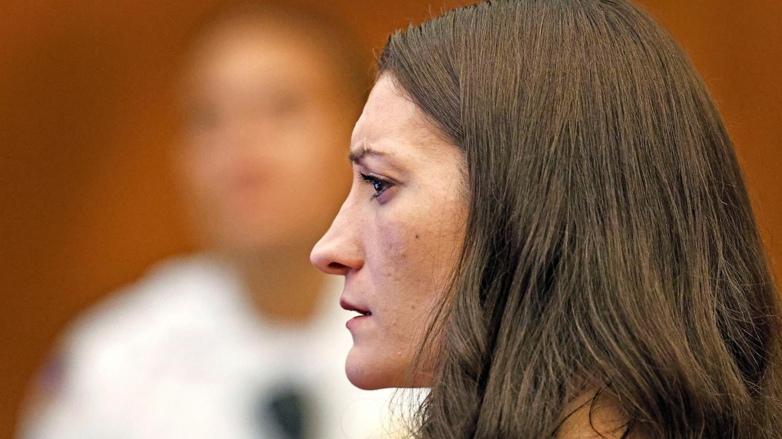 PHOTO: Lindsay Clancy, who is accused of killing her children, watches as her ex-husband Patrick Clancy takes the witness stand, during her murder trial at Plymouth Superior Court, in Plymouth, Mass, July 27, 2026.