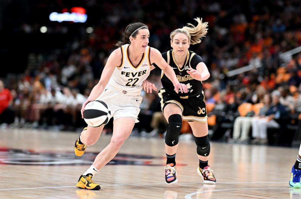 PHOTO: Caitlin Clark #22 of the Indiana Fever handles the ball in the first quarter against Karlie Samuelson #44 of the Washington Mystics at Capital One Arena, June 7, 2024, in Washington, D.C. 