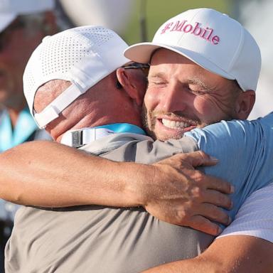 PHOTO: Wyndham Clark celebrates with father Randall after winning the 126th U.S. Open and Joe Russell talks to son Miles Russell on the 18th hole during the final round of the U.S. Open at Shinnecock Hills Golf Club in Southampton, N.Y., June 21, 2026.