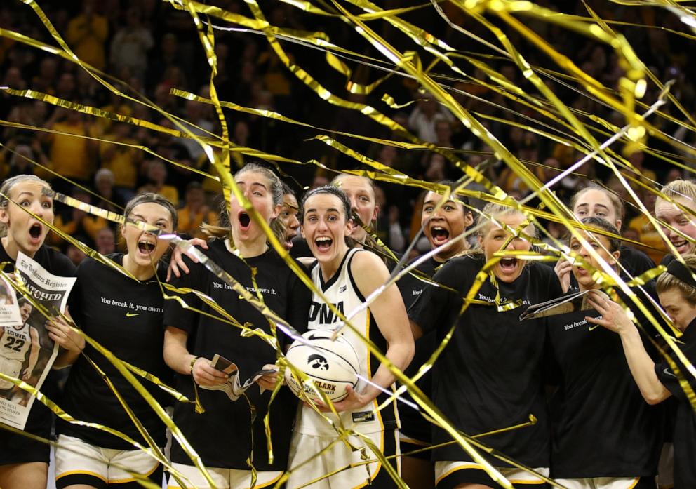 PHOTO: Guard Caitlin Clark celebrates with teammates during a presentation after breaking the NCAA women's all-time scoring record during the game against the Michigan Wolverines  at Carver-Hawkeye Arena on Feb. 15, 2024 in Iowa City, Iowa.  