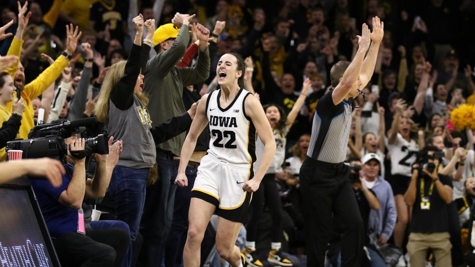 PHOTO: Caitlin Clark #22 of the Iowa Hawkeyes celebrates after breaking the NCAA women's all-time scoring record during the first half against the Michigan Wolverines at Carver-Hawkeye Arena on Feb. 15, 2024 in Iowa City, Iowa.