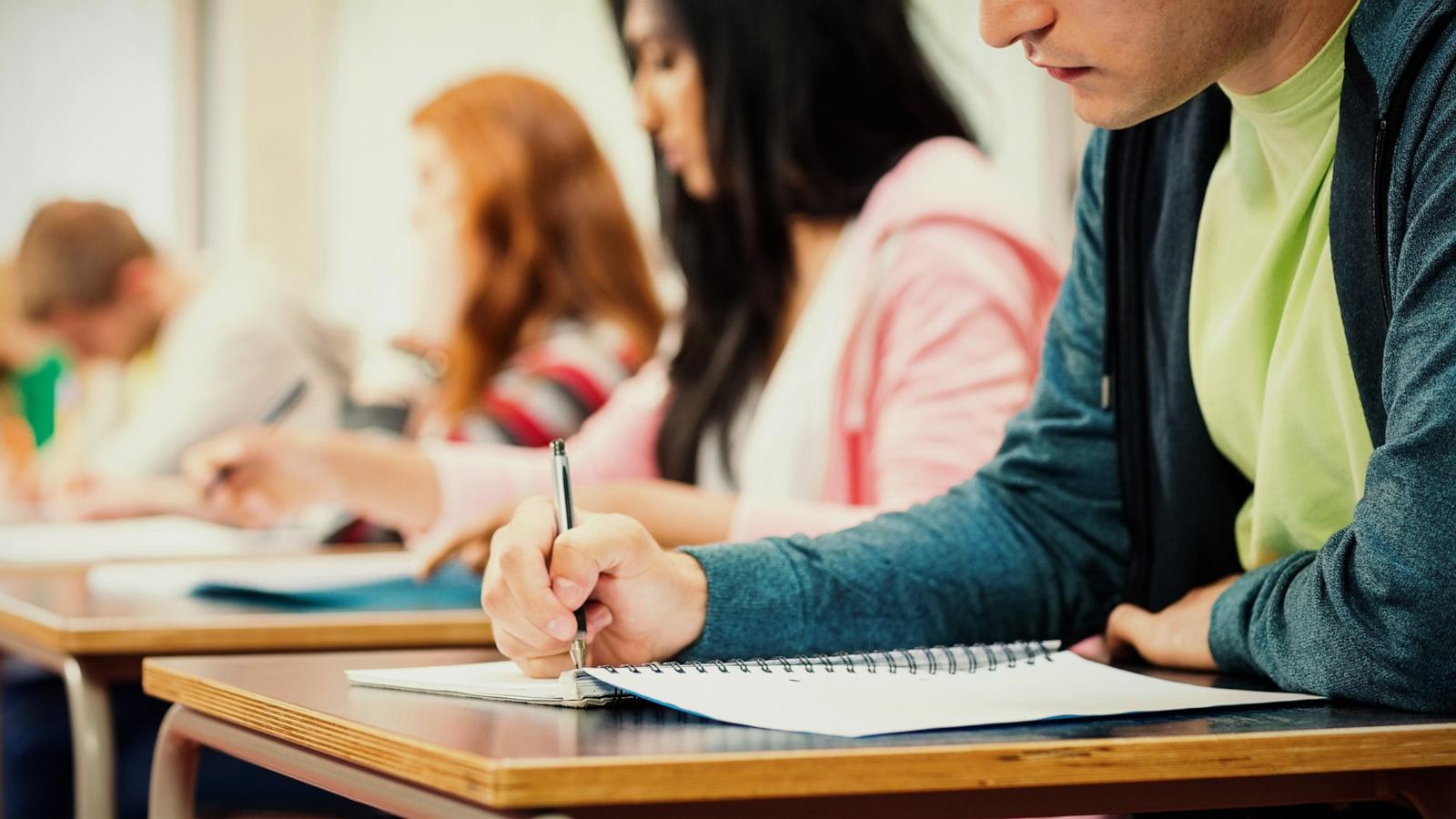 PHOTO: Stock photo of students taking a test in a classroom.