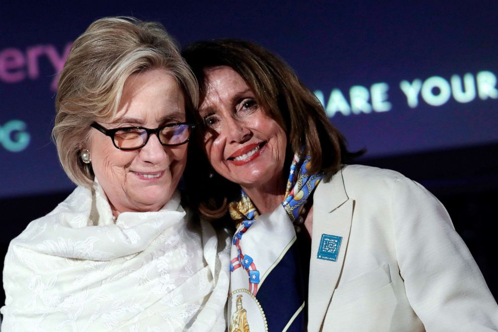 PHOTO: Former U.S. Secretary of State Hillary Rodham Clinton and House Speaker Nancy Pelosi pose for a group photo at a National Portrait Gallery Women's History Month reception in Washington, D.C., March 28, 2019.