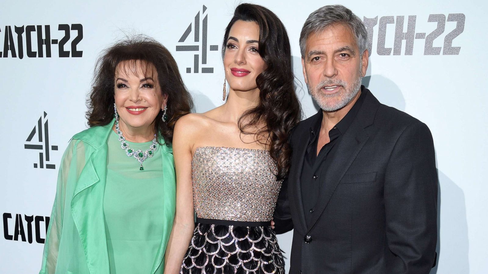 PHOTO:Baria Alamuddin, Amal Clooney and George Clooney attend the "Catch 22" UK premiere, May 15, 2019, in London.