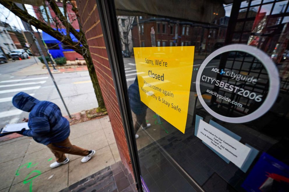 PHOTO: A sign hangs on the door of the Union Grill, temporarily closed due to COVID-19, in the Oakland neighborhood of Pittsburgh on Jan. 28, 2021.