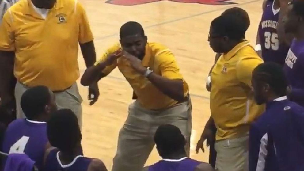 PHOTO: Coach Sekoe White of the Mississippi School for the Deaf was recorded as he used American Sign Language to communicate with his team.