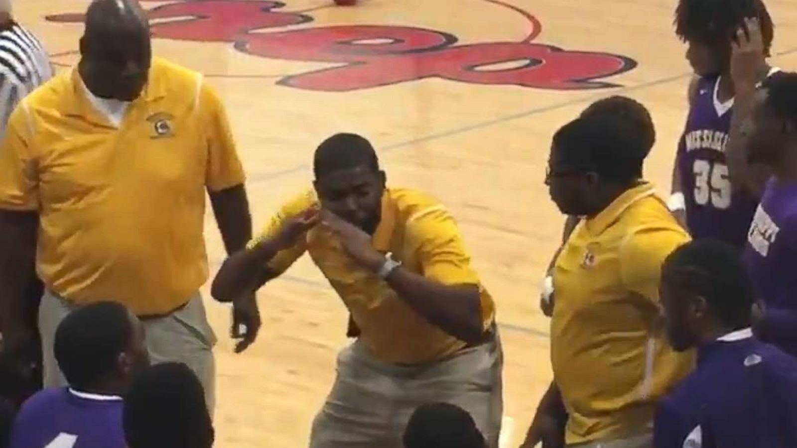 PHOTO: Coach Sekoe White of the Mississippi School for the Deaf was recorded as he used American Sign Language to communicate with his team.