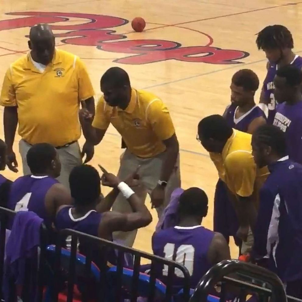 PHOTO: Coach Sekoe White of the Mississippi School for the Deaf was recorded as he used American Sign Language to communicate with his team.