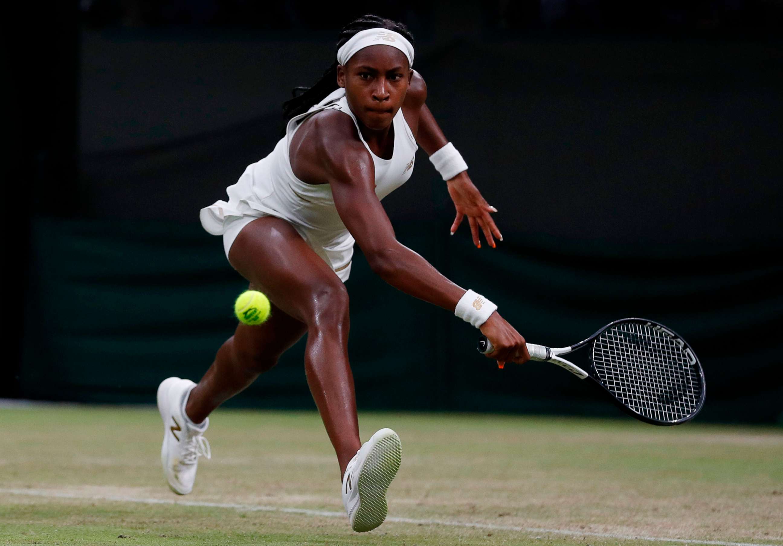 PHOTO: US player Cori Gauff returns against Slovakia's Magdalena Rybarikova during their women's singles second round match on the third day of the 2019 Wimbledon Championships at The All England Lawn Tennis Club in Wimbledon.
