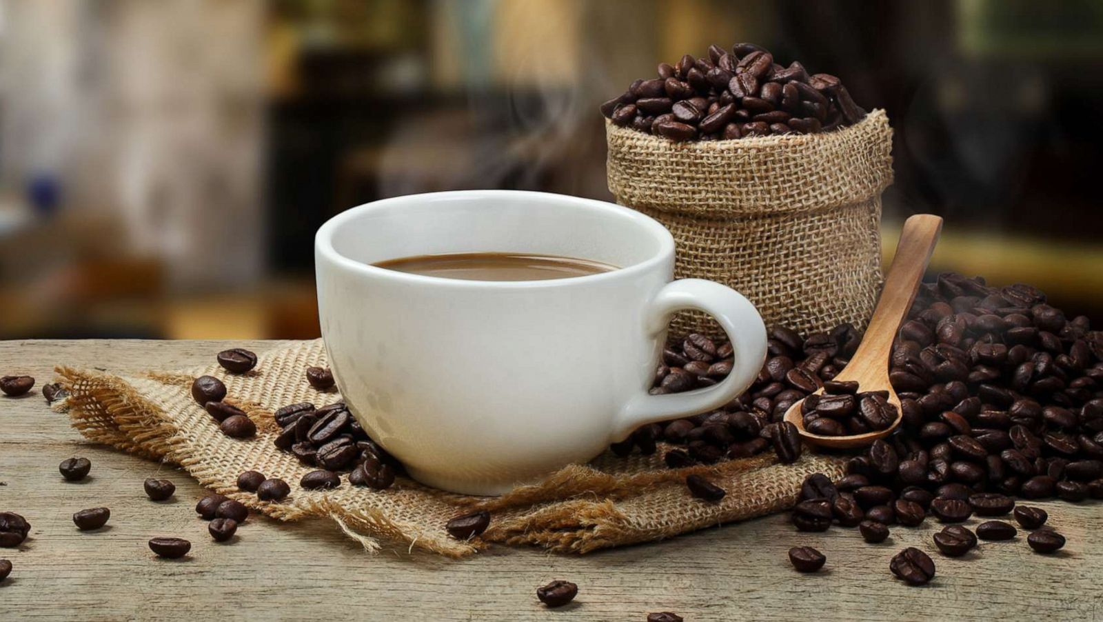 PHOTO: A cup of hot coffee cup and coffee beans are pictured in a stock image.