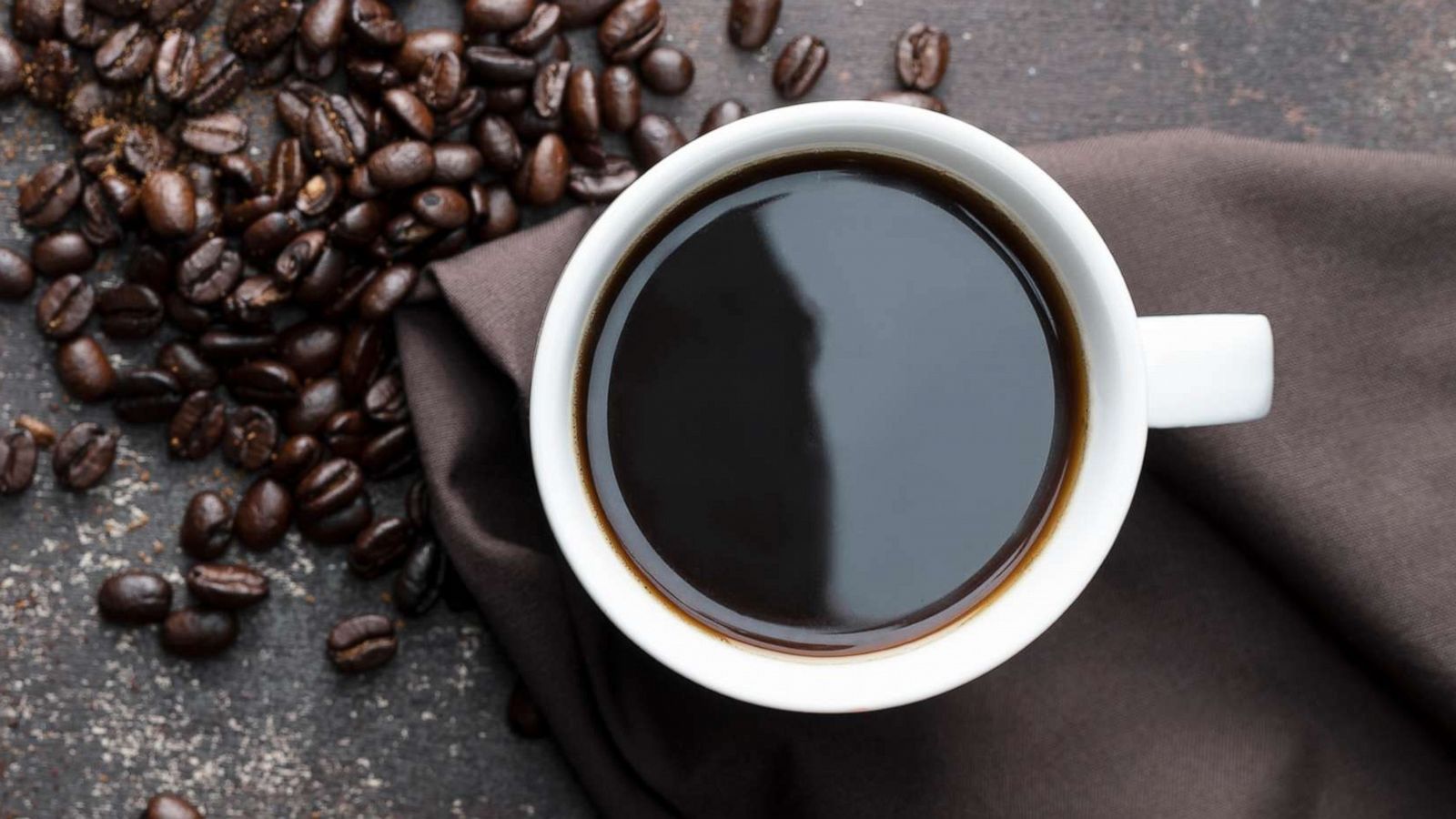 PHOTO: A cup of coffee is arranged with roasted coffee beans in an undated stock photo.