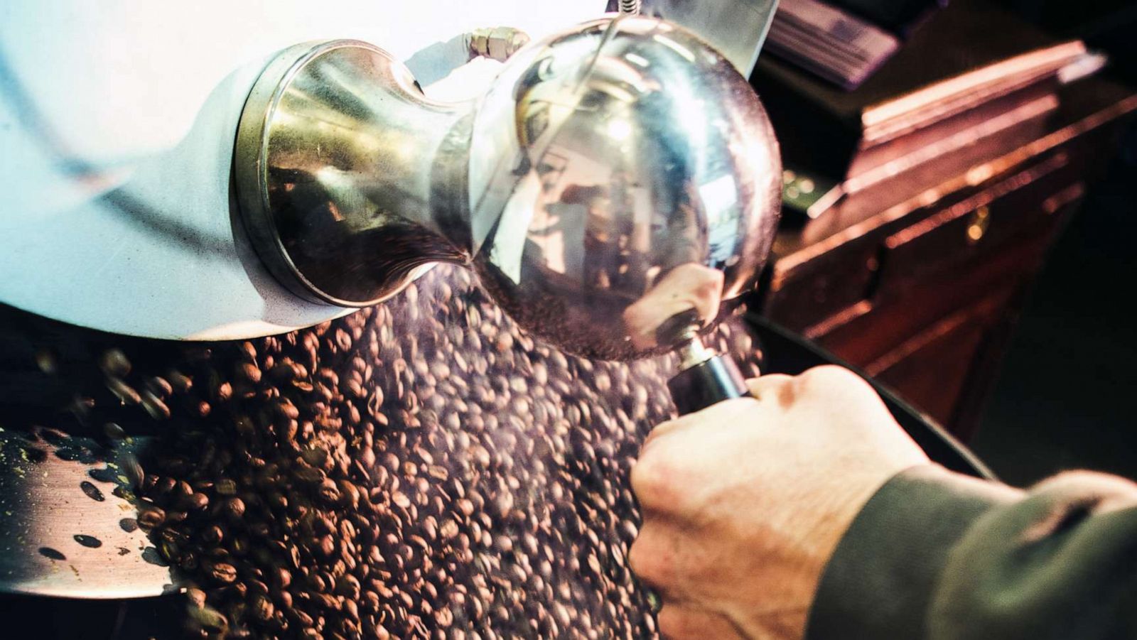 PHOTO: In this stock photo coffee beans are put in a large industrial roaster.