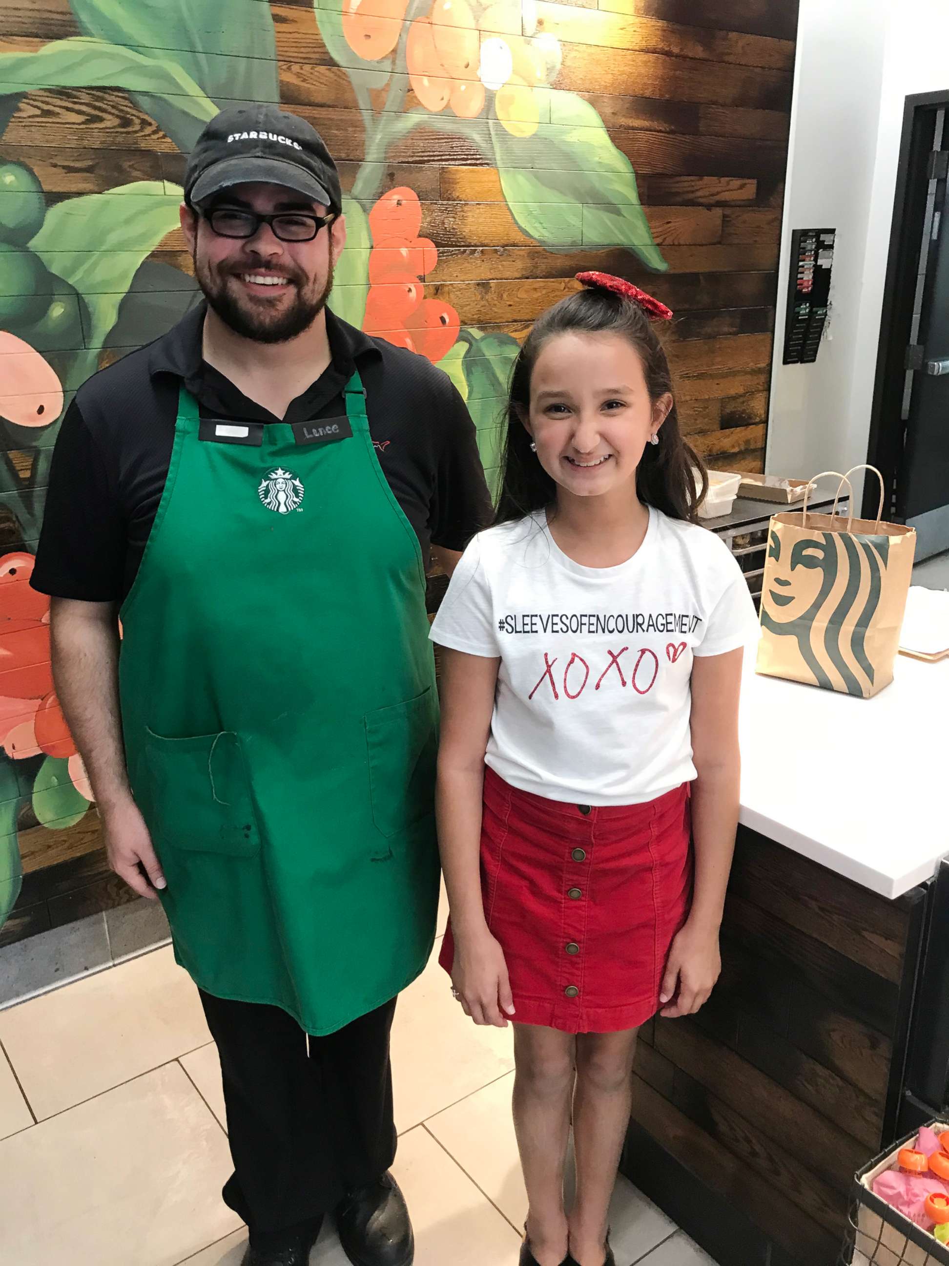 PHOTO: Nine-year-old Ayvah Doyle from Port Neches, Texas, is pictured with a Starbucks employee.