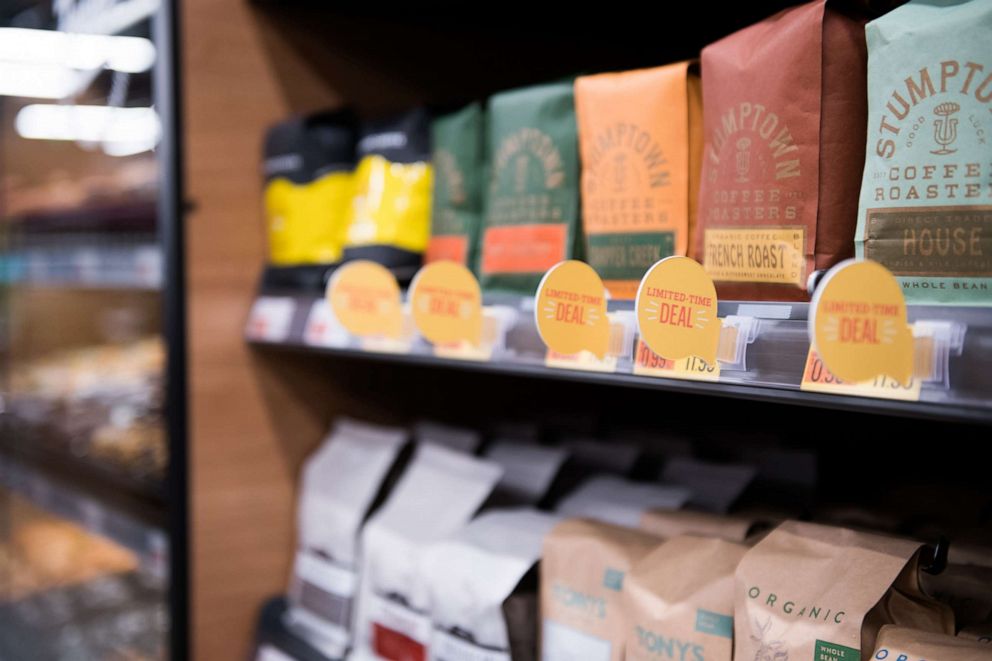 PHOTO: In this Feb. 24, 2020 file photo bags of coffee beans sit on shelves during a tour of a new Amazon Go store in the Capitol Hill neighborhood of Seattle.