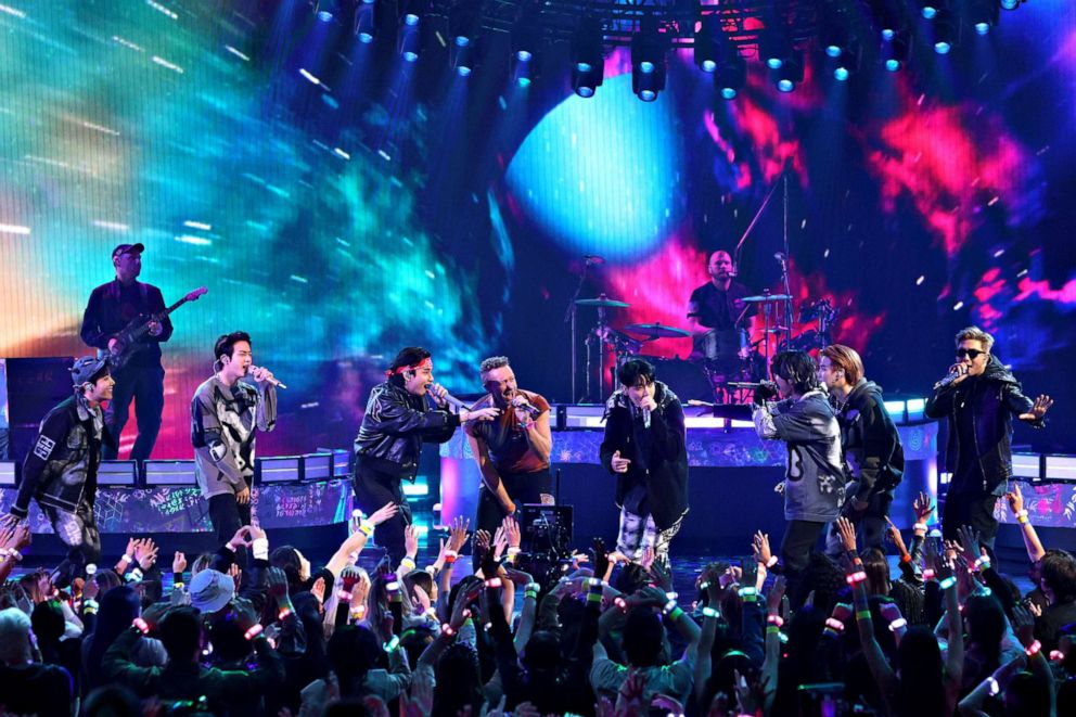 PHOTO: Chris Martin of Coldplay, center, and, from left, J-Hope, Jin, V, Jungkook, Jimin, Suga, and RM of BTS perform onstage during the 2021 American Music Awards at Microsoft Theater on Nov. 21, 2021 in Los Angeles, Calif.