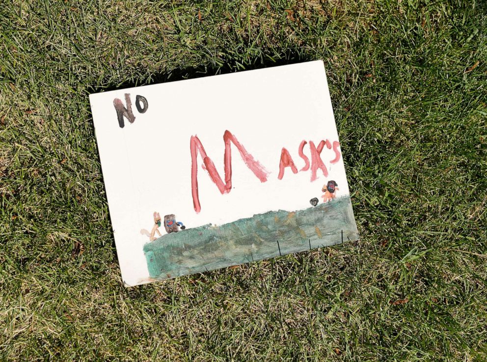 PHOTO: A sign made by a child for an anti-masking rally outside Jeffco Public health headquarters was left behind on Aug. 4, 2021 in Lakewood, Colo. 