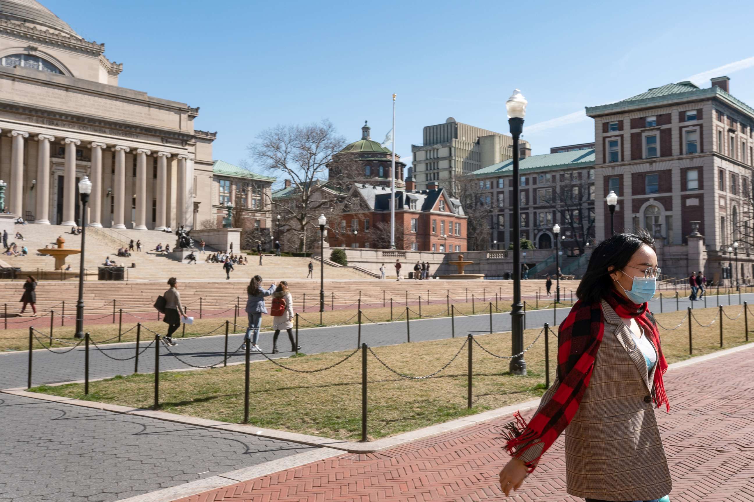PHOTO: In this file photo, a woman wearing a protective mask walks on the Columbia University campus on March 9, 2020 in New York.
