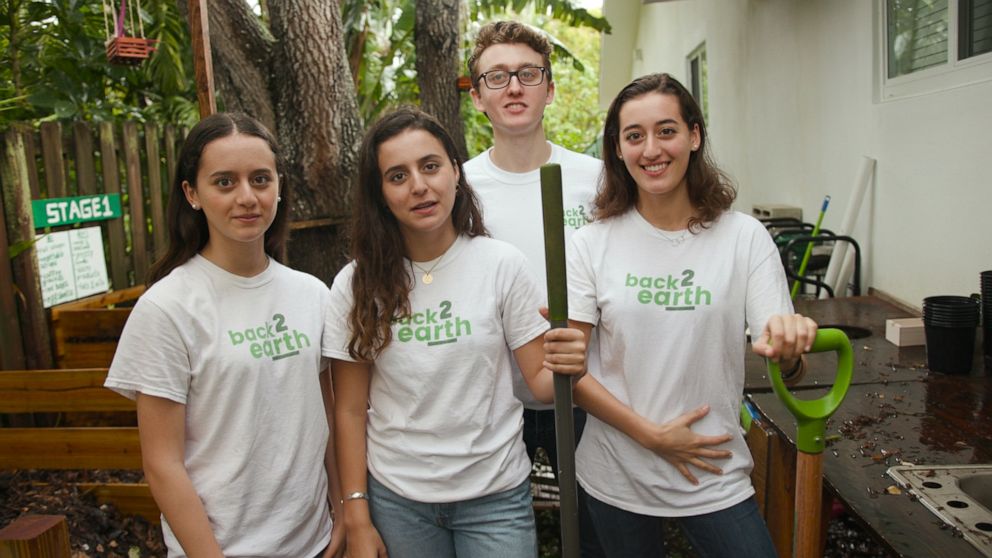 PHOTO: Ugo and Emma Angeletti pose with their younger sisters who also help with their charity, back2earth.