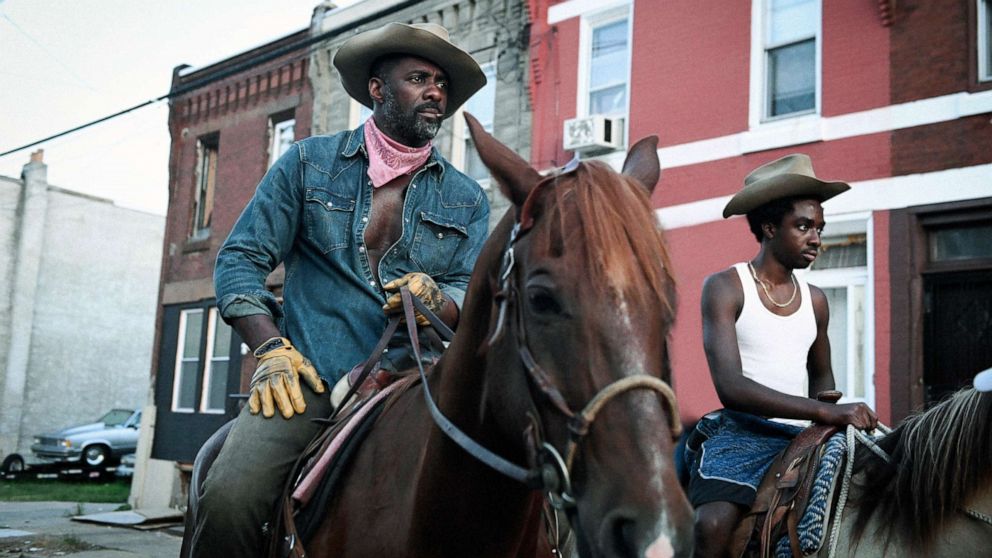 Idris Elba, left, and Caleb McLaughlin in a scene from the film "Concrete Cowboy."