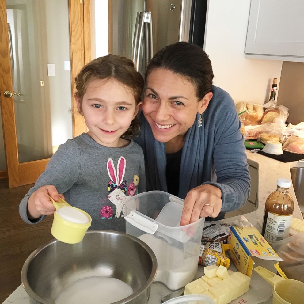 PHOTO: Elisa Strauss and her daughter preparing to make cookies.