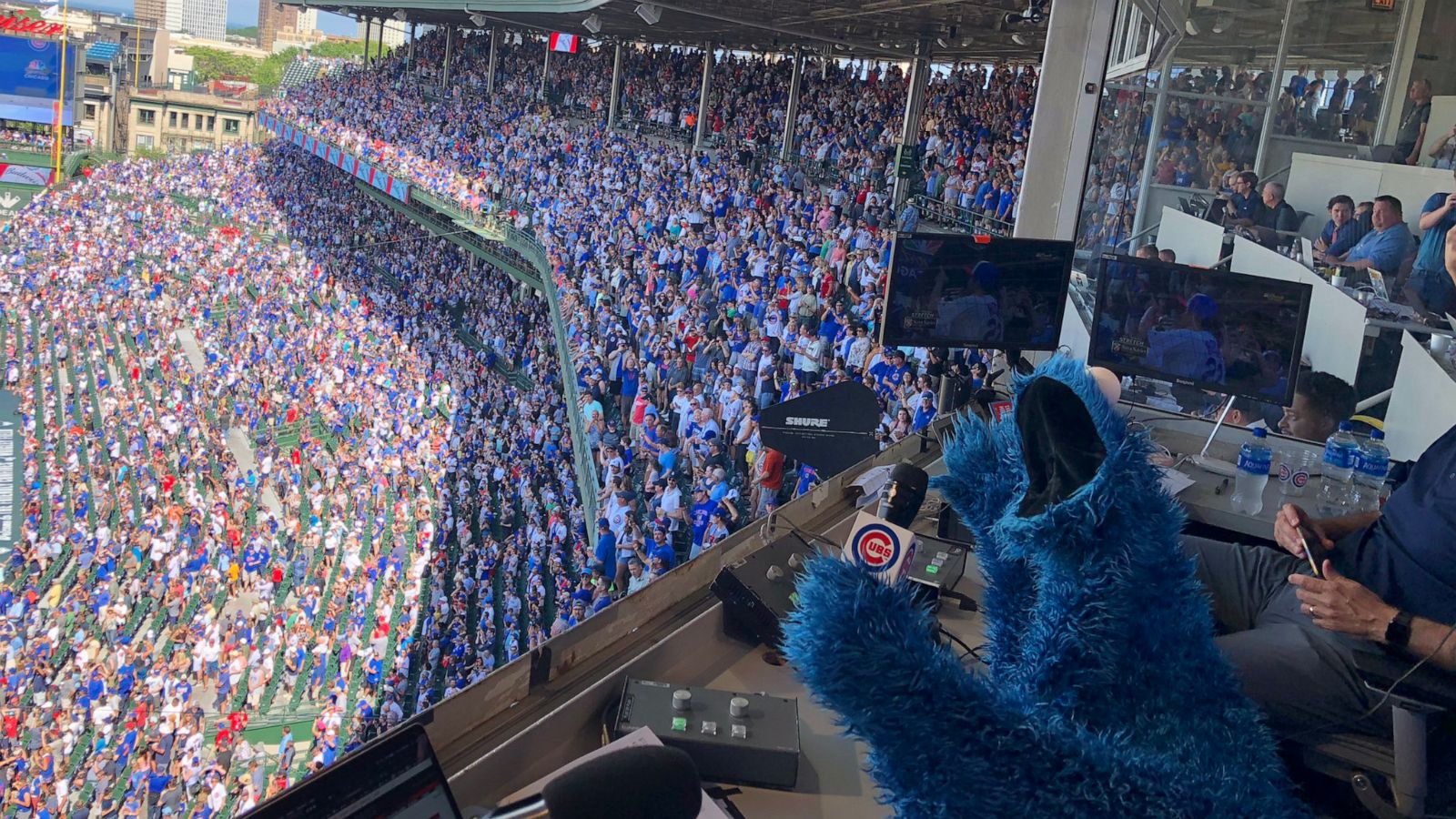 PHOTO: Cookie Monster sings "take me out to the ballgame," at Wrigley Field during the 7th inning stretch on June 27, 2019.