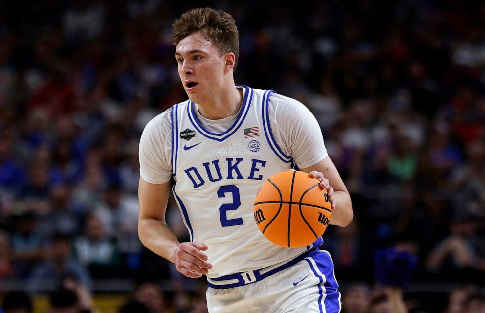 PHOTO: Cooper Flagg of the Duke Blue Devils dribbles up court against the Houston Cougars in the first half during the Final Four round of the men's NCAA basketball tournament , April 5, 2025 in San Antonio, Texas.
