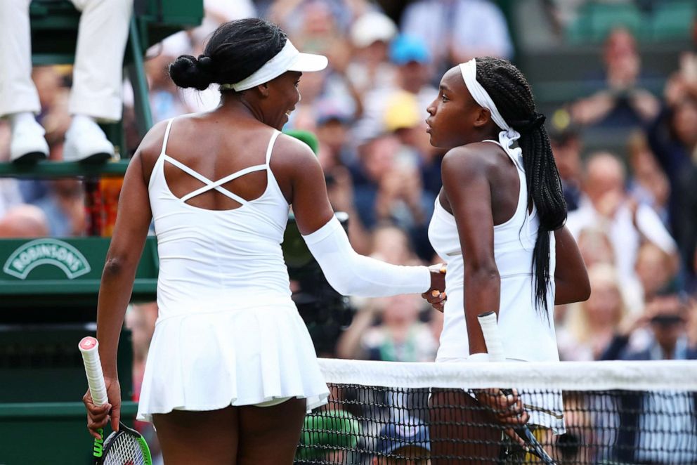 PHOTO: Cori Gauff shakes hands at the net with Venus Williams after her Ladies' Singles first round match during day one of The Championships - Wimbledon 2019, July 1, 2019, in London.