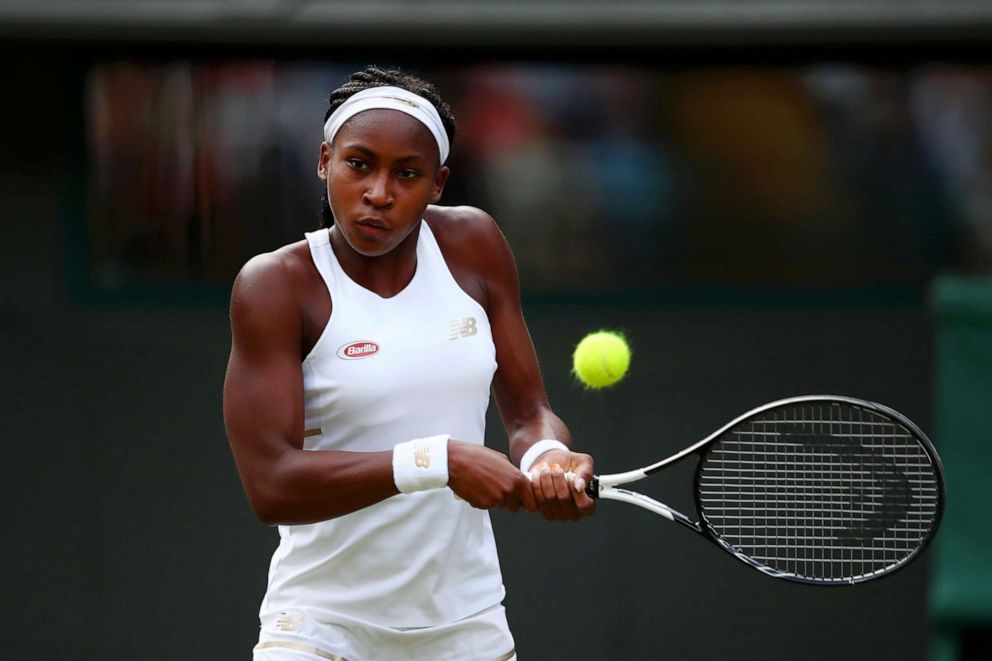 PHOTO: Cori Gauff of the United States plays a backhand in her Ladies' Singles first round match against Venus Williams of The United States during day one of The Championships - Wimbledon 2019 on July 01, 2019, in London.