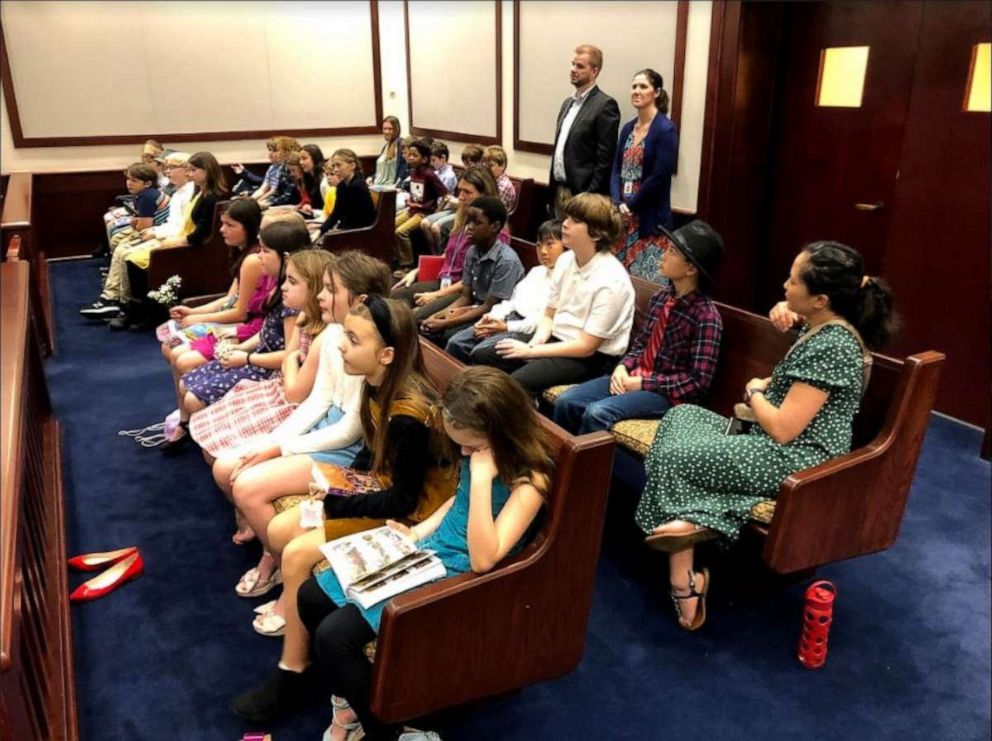 PHOTO:  Cornerstone Learning Community sudents watch as their teacher Annmarie Small becomes a U.S. citizen.