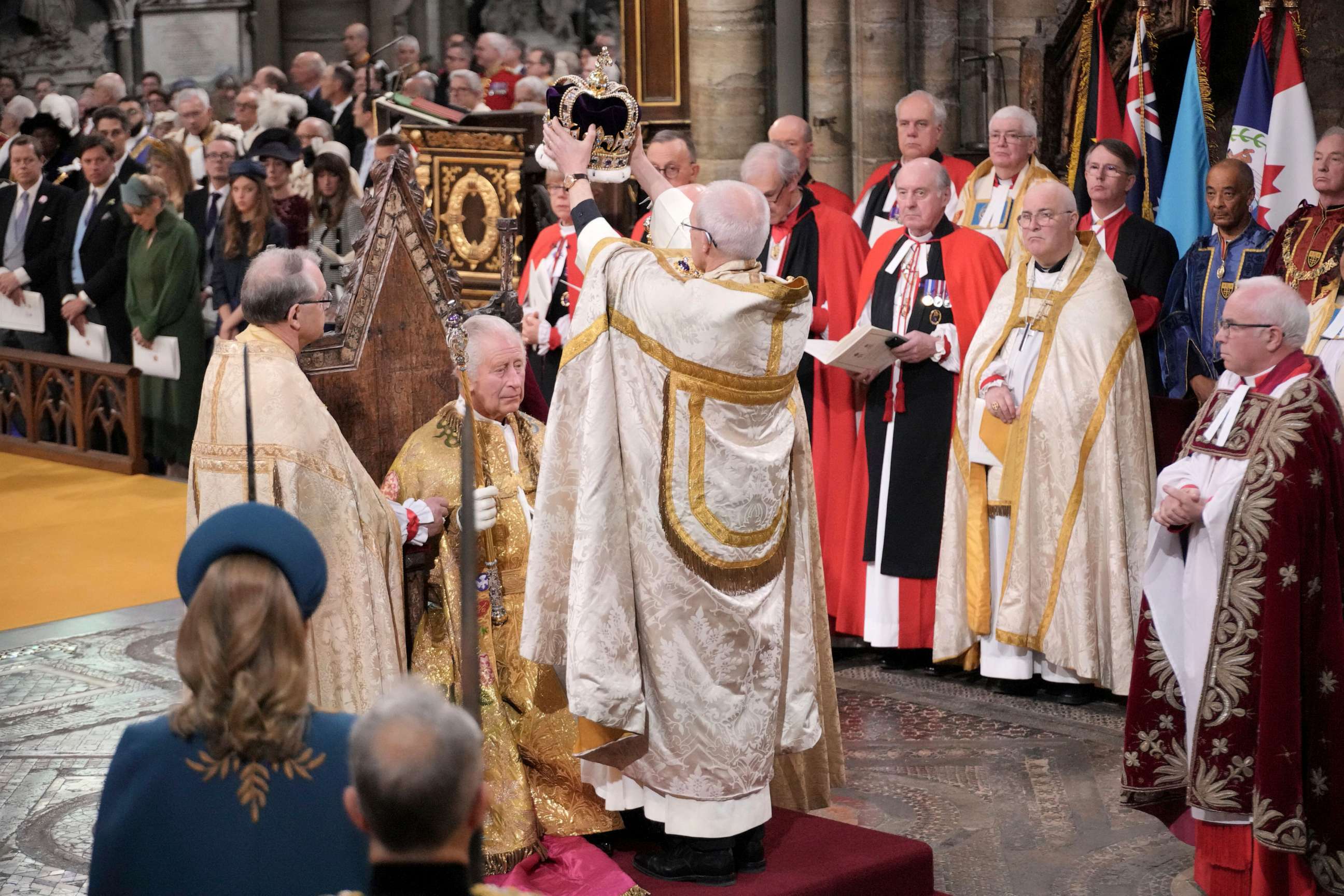 PHOTO: King Charles III sits as he receives The St Edward's Crown during the coronation ceremony at Westminster Abbey, London, Saturday, May 6, 2023. (Jonathan Brady/Pool Photo via AP)