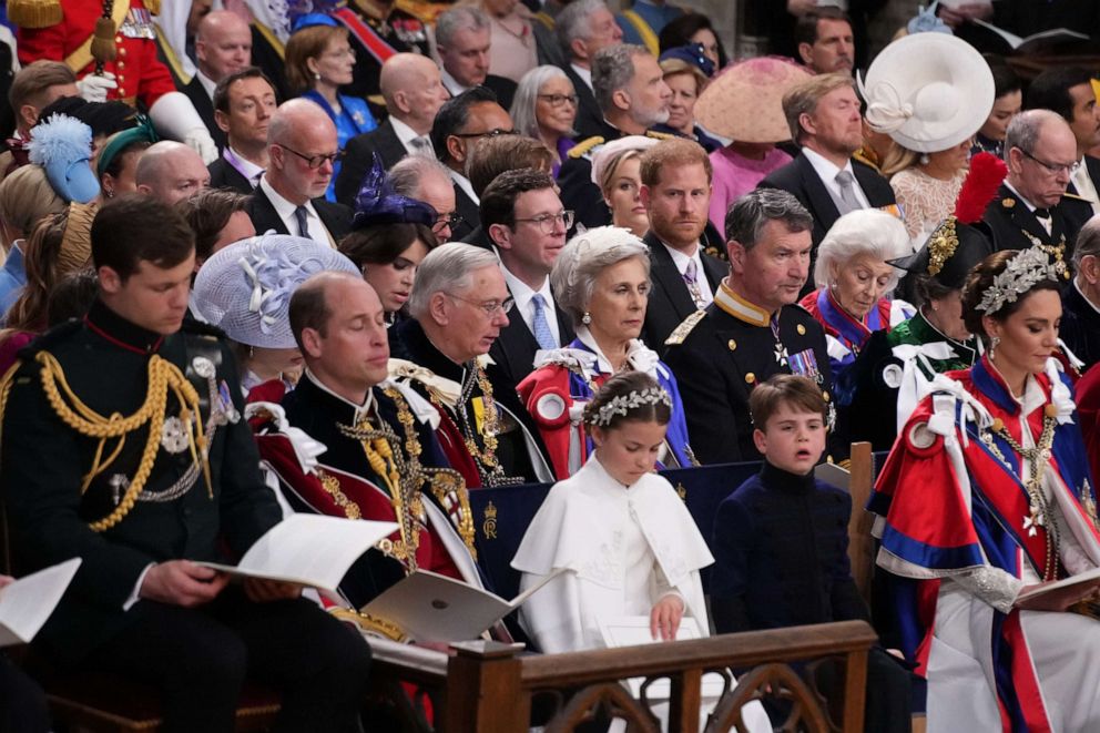 PHOTO: Prince Harry, Duke of Sussex sits behind Prince William, Prince of Wales, Princess Charlotte, Prince Louis and Catherine, Princess of Wales during the coronation ceremony of King Charles III and Queen Camilla, May 6, 2023, in London, England.
