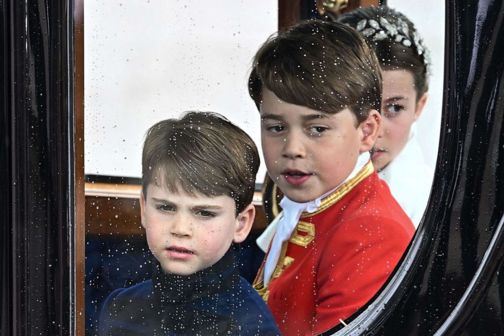 PHOTO: Britain's Prince Louis of Wales, Prince George of Wales and Princess Charlotte of Wales travel back to Buckingham Palace from Westminster Abbey after the coronation of King Charles III and Queen Camilla in London, May 6, 2023.