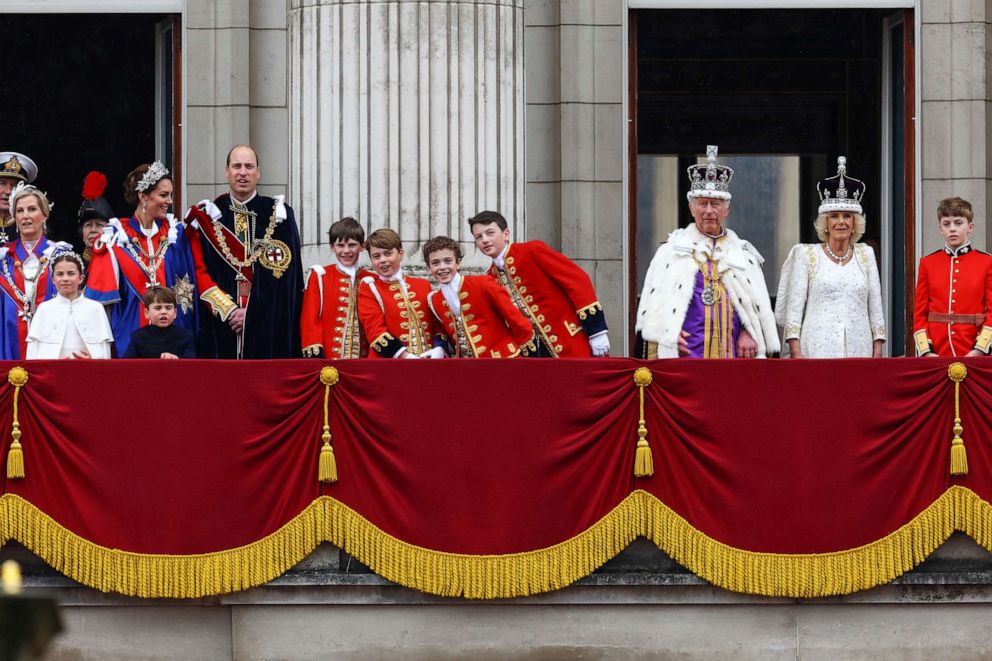 PHOTO: Britain's King Charles and Queen Camilla stand on the Buckingham Palace balcony following the coronation ceremony in London, May 6, 2023.