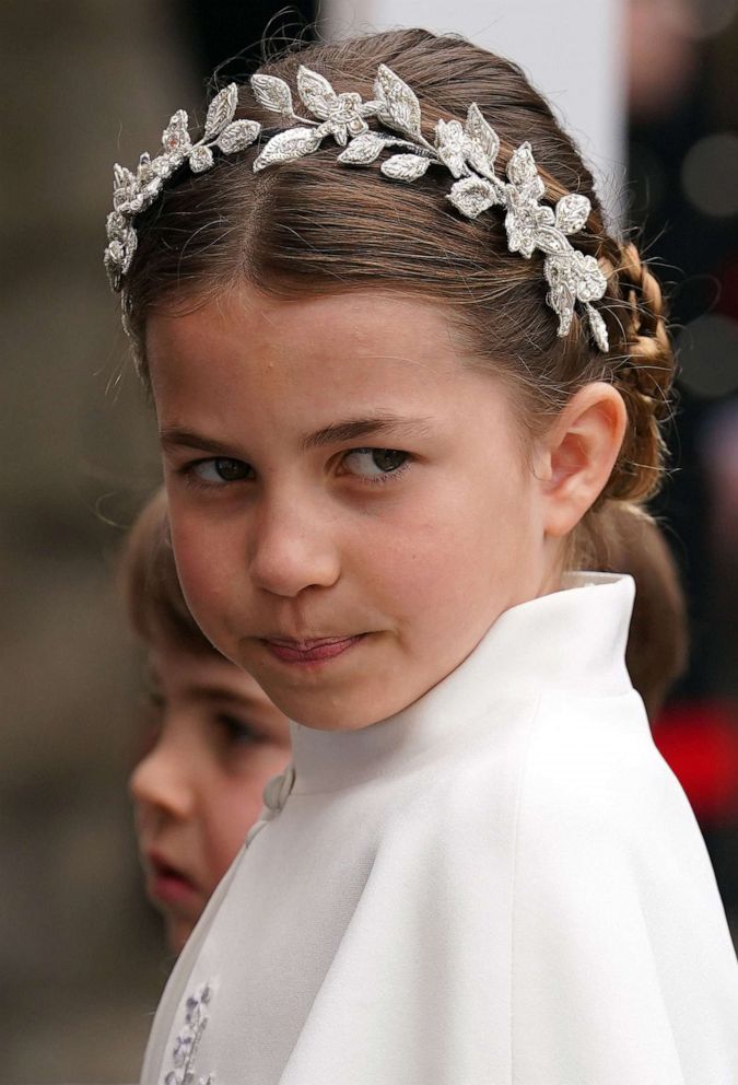 Princesses Kate, Charlotte twin in silver floral headpieces at