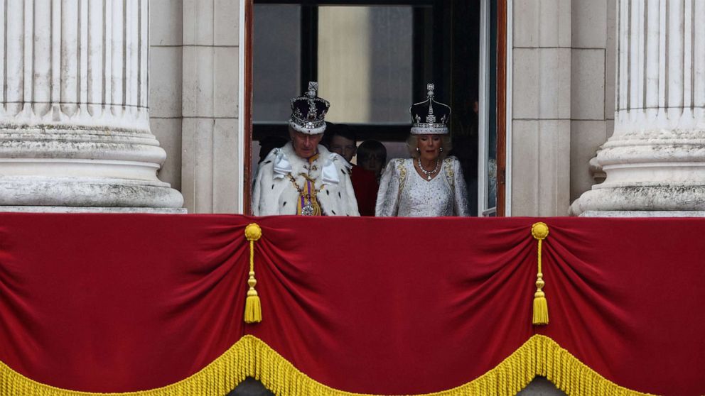 PHOTO: Britain's King Charles and Queen Camilla stand on the Buckingham Palace balcony following their coronation ceremony in London, May 6, 2023.